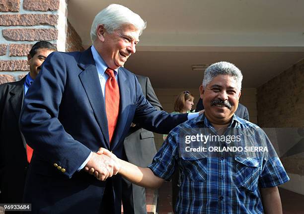 Senator Christopher J. Dood jokes as he shakes hands with Honduran Congress' vice-president and member of the National Popular Resistance Front,...