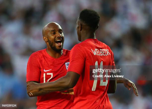 Danny Welbeck of England celebrates with team mate Fabian Delph of England after scoring his sides second goal during the International Friendly...