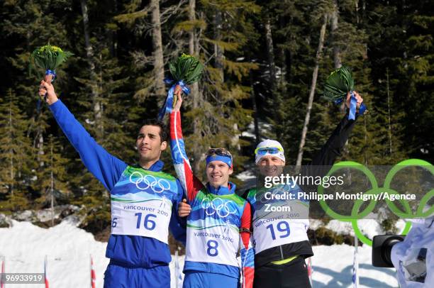 Evgeny Ustyugov of Russia takes 1st place, Martin Fourcade of France takes 2nd place, Pavol Hurajt of Slovakia takes 3rd place during the Men's...