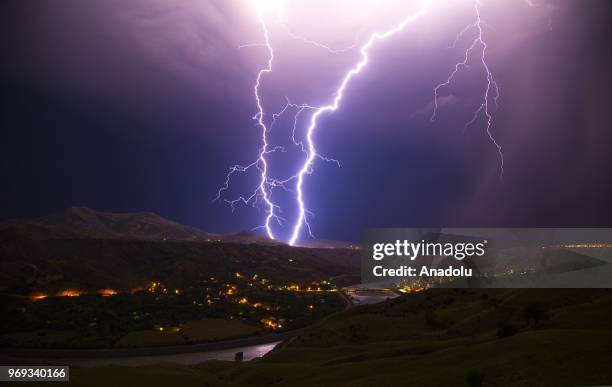 Lightnings illuminate the sky over Historical Palu district of Turkey's Elazig during a rainfall on June 07, 2018.