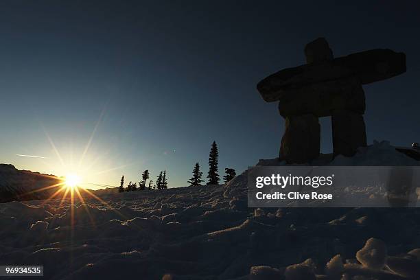 An Inukshuk, symbol of the 2010 Olympic Winter Games is pictured as the sun rises ahead of the Alpine Skiing Men's Super Combined Downhill on day 10...