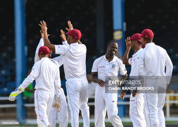 Kemar Roach of West Indies celebrates the dismissal of Kusal Perera of Sri Lanka during day 2 of the 1st Test between West Indies and Sri Lanka at...