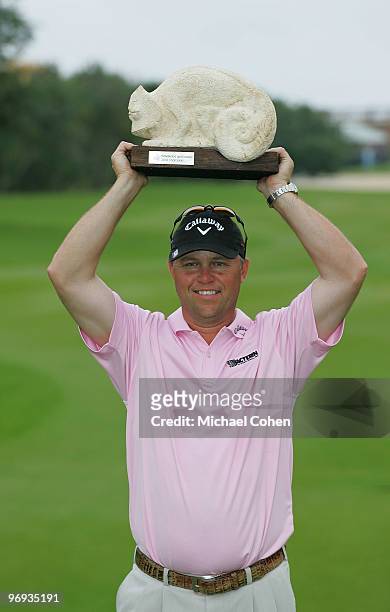 Cameron Beckman holds the trophy after winning the Mayakoba Golf Classic at El Camaleon Golf Club held on February 21, 2010 in Riviera Maya, Mexico.
