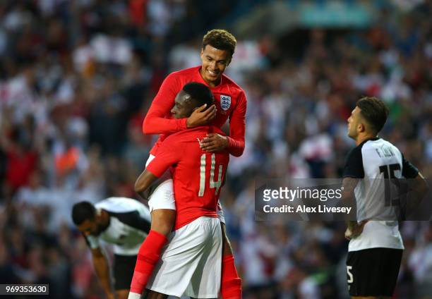 Dele Alli and Danny Welbeck of England celebrate after Danny Welbeck scored their sides second goal during the International friendly match between...