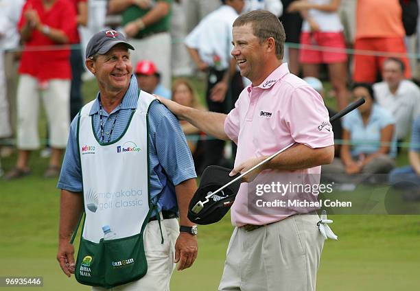 Cameron Beckman celebrates with his caddie, John "Cubby" Burke after winning the Mayakoba Golf Classic at El Camaleon Golf Club held on February 21,...