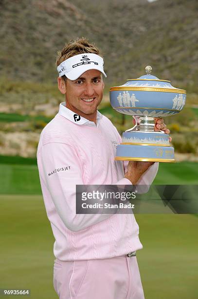 Ian Poulter of England holds the Walter Hagen Cup Trophy after the final round of the World Golf Championships-Accenture Match Play Championship at...