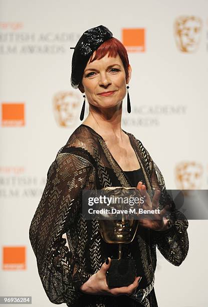 Sandy Powell poses with the Best Costume Design Award during the The Orange British Academy Film Awards 2010 at The Royal Opera House on February 21,...