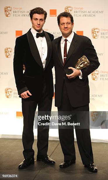 Michael Giacchino poses with the Best Music Award for Up presented by Aaron Johnson during the The Orange British Academy Film Awards 2010 at The...