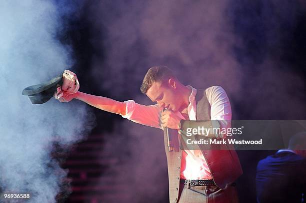 Olly Murs performs on stage at Wembley Arena on February 21, 2010 in London, England.
