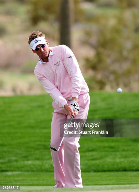 Ian Poulter of England plays his chip shot on the 10th hole during the final round of the Accenture Match Play Championship at the Ritz-Carlton Golf...