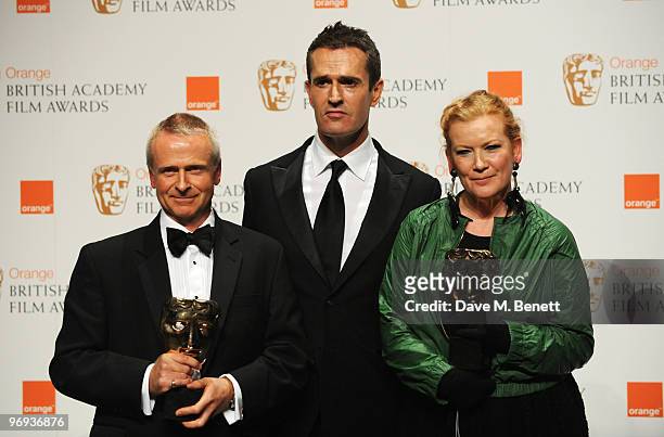 Director Andrea Arnold and producer Nick Laws pose the Outstanding British Film award for Fish Tank presented by Rupert Everett during the The Orange...