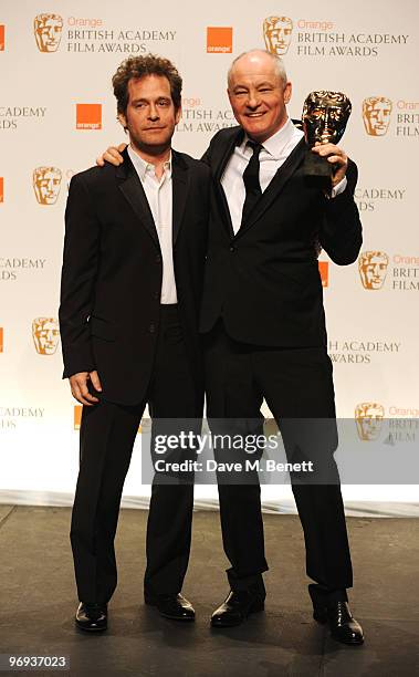 Barry Ackroyd poses with the Cinematography Award for The Hurt Locker presented by Tom Hollander during the The Orange British Academy Film Awards...
