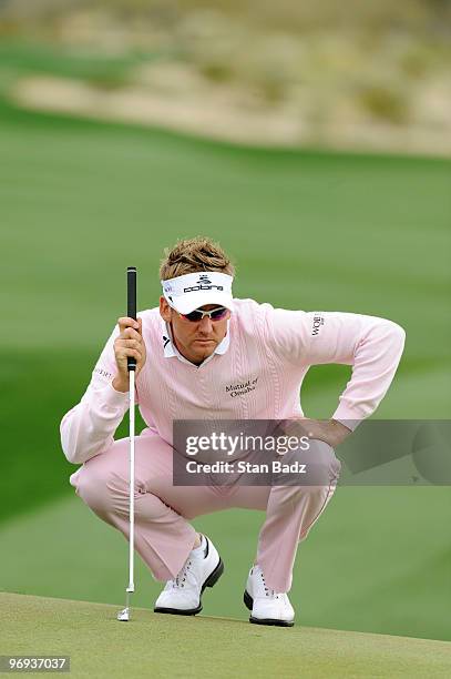 Ian Poulter of England lines a putt at the third green during the final round of the World Golf Championships-Accenture Match Play Championship at...