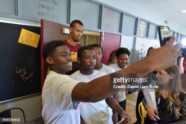 Young participants take a selfie with Rodney Hood of the Cleveland Cavaliers during the 2018 NBA Finals Legacy Project - NBA Cares on June 07, 2018...