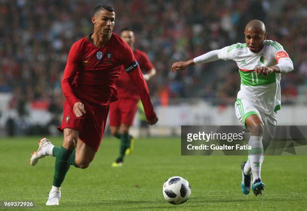 Portugal and Real Madrid forward Cristiano Ronaldo with Algeria and FC Porto forward Yacine Brahimi in action during the International Friendly match...
