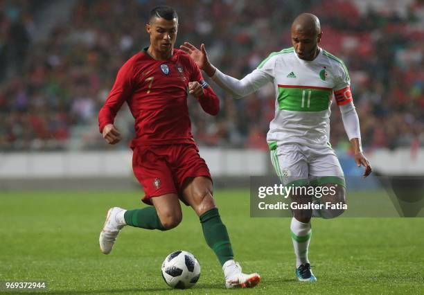 Portugal and Real Madrid forward Cristiano Ronaldo with Algeria and FC Porto forward Yacine Brahimi in action during the International Friendly match...