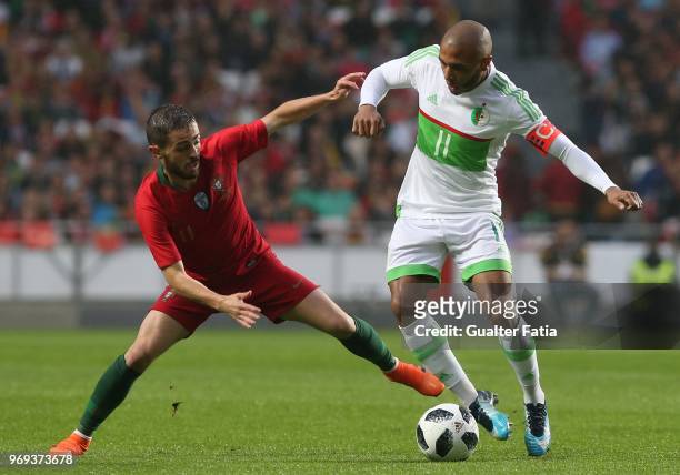 Algeria and FC Porto forward Yacine Brahimi with Portugal and Manchester City midfielder Bernardo Silva in action during the International Friendly...