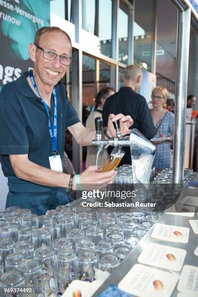 Beer is poured at the summer party 2018 of the German Producers Alliance on June 7, 2018 in Berlin, Germany.