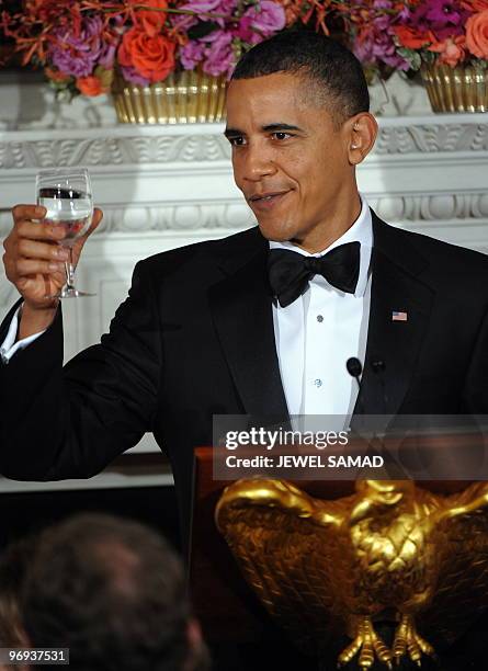 President Barack Obama makes a toast during the White House�s annual Governors� Ball at the State Dining Room of the White House in Washington, DC,...