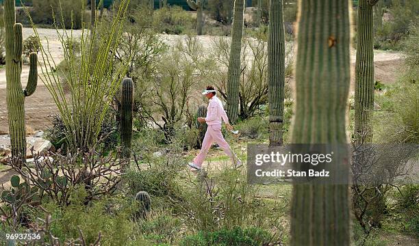 Ian Poulter of England walks to the 12th green the final round of the World Golf Championships-Accenture Match Play Championship at The Ritz-Carlton...