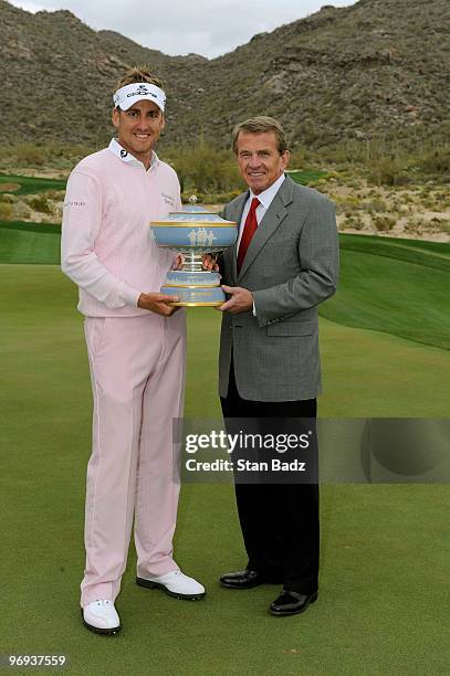 Ian Poulter of England, left, and PGA TOUR Commissioner Tim Finchem, right, posed with the Walter Hagen Cup Trophy after the final round of the World...