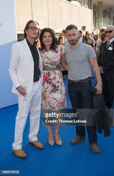 Oskar Roehler, Jasmin Tabatabai and Clemens Schick attend the summer party 2018 of the German Producers Alliance on June 7, 2018 in Berlin, Germany.