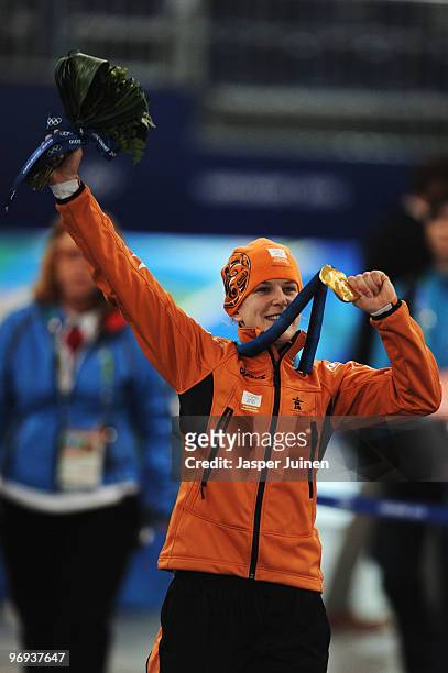 Ireen Wust of Netherlands celebrates winning the gold medal during the medal ceremony for the women's 1500 m speed skating on day 10 of the Vancouver...