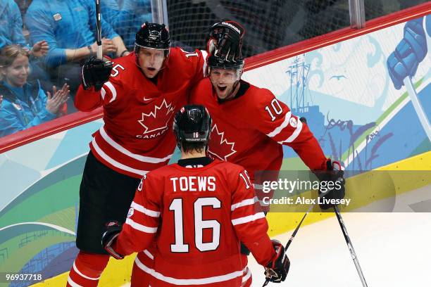 Dany Heatley, Brenden Morrow and Jonathan Toews of Canada celebrate after Heatley scored a goal in the second period during the ice hockey men's...