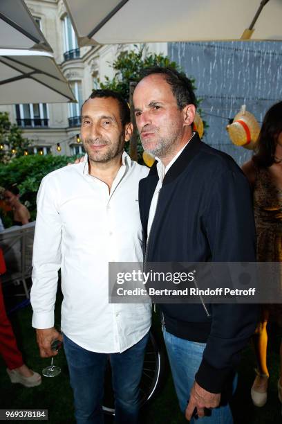 Zinedine Soualem and Lionel Abelanski attend "Le Jardin De Joy" Cocktail at Hotel Barriere Le Fouquet's on June 7, 2018 in Paris, France.