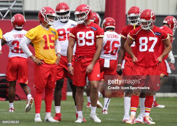 Kansas City Chiefs quarterback Patrick Mahomes talks with tight ends Jace Amaro and Travis Kelce during Organized Team Activities on June 7, 2018 at...