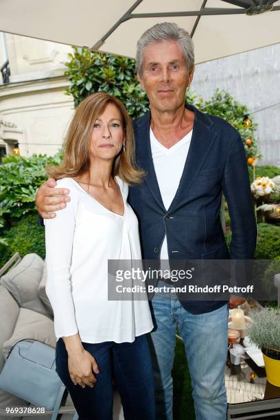 Anne Gravoin and Dominique Desseigne attend "Le Jardin De Joy" Cocktail at Hotel Barriere Le Fouquet's on June 7, 2018 in Paris, France.