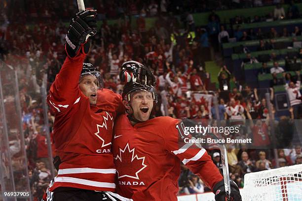 Dany Heatley and Brenden Morrow of Canada celebrate after Heatley scored a gola in the second period during the ice hockey men's preliminary game...