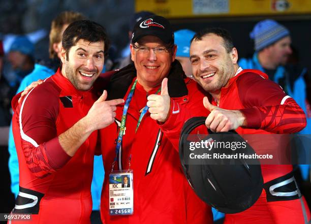 Prince Albert II of Monaco poses with Monaco 1 members Patrice Servelle and Sebastien Gattuso during the Two-Man Bobsleigh Heat 4 on day 10 of the...