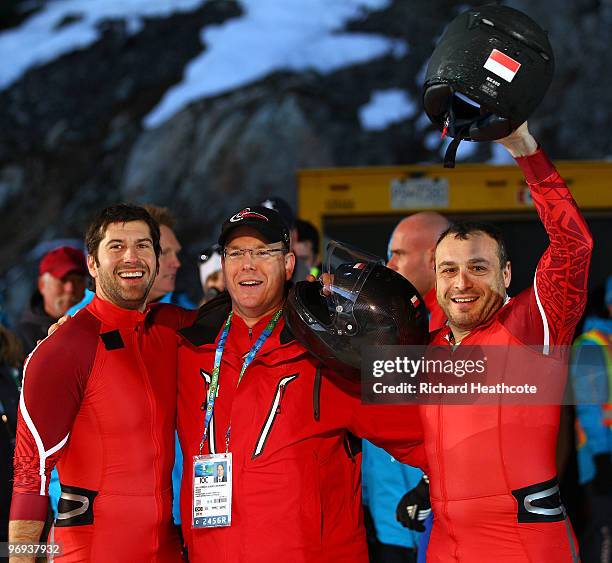 Prince Albert II of Monaco poses with Monaco 1 members Patrice Servelle and Sebastien Gattuso during the Two-Man Bobsleigh Heat 4 on day 10 of the...