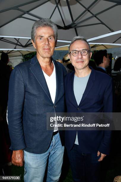 Dominique Desseigne and Philippe Besson attend "Le Jardin De Joy" Cocktail at Hotel Barriere Le Fouquet's on June 7, 2018 in Paris, France.