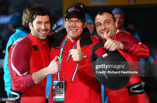 Prince Albert II of Monaco poses with Monaco 1 members Patrice Servelle and Sebastien Gattuso during the Two-Man Bobsleigh Heat 4 on day 10 of the...