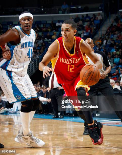 Kevin Martin of the Houston Rockets drives around James Posey of the New Orleans Hornets on February 21, 2010 at the New Orleans Arena in New...