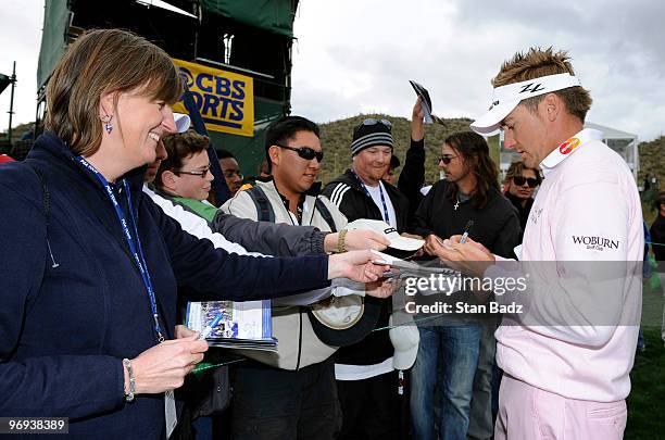 Ian Poulter of England signs autographs for fans after his win of the final round of the World Golf Championships-Accenture Match Play Championship...