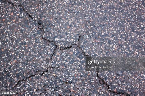 old wet worn and cracked asphalt with cracks - rougness stock pictures, royalty-free photos & images