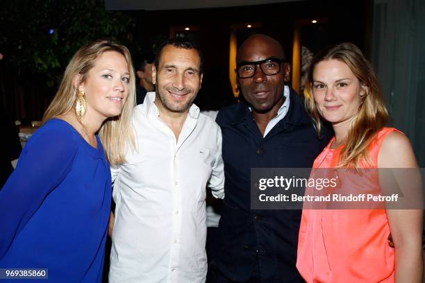 Caroline Faindt, Zinedine Soualem, Lucien Jean-Baptiste and his wife attend "Le Jardin De Joy" Cocktail at Hotel Barriere Le Fouquet's on June 7,...