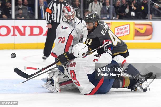 Pierre-Edouard Bellemare of the Vegas Golden Knights takes a shot on Braden Holtby as Dmitry Orlov of the Washington Capitals defends during the...