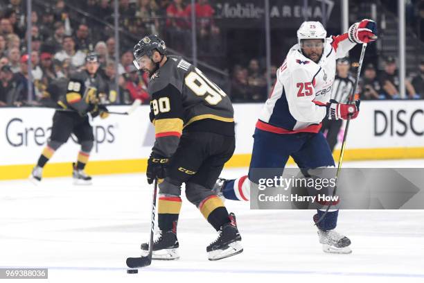 Tomas Tatar of the Vegas Golden Knights is defended by Devante Smith-Pelly of the Washington Capitals \during the first period in Game Five of the...