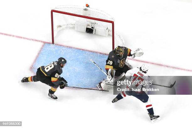 Marc-Andre Fleury of the Vegas Golden Knights defends a shot from T.J. Oshie of the Washington Capitals during the first period in Game Five of the...