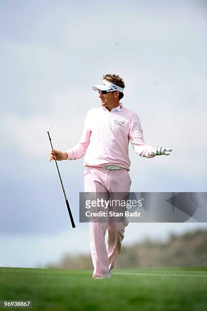 Ian Poulter of England reacts to his fairway shot to the eighth green during the final round of the World Golf Championships-Accenture Match Play...