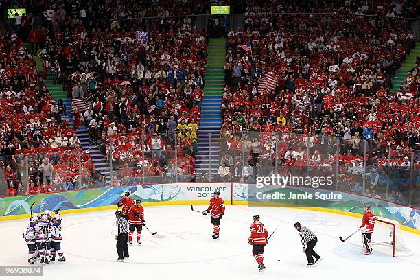 Players from the UNited States celebrate after Jamie Langenbrunner scored a power play goal in the third period against Martin Brodeur of Canada...