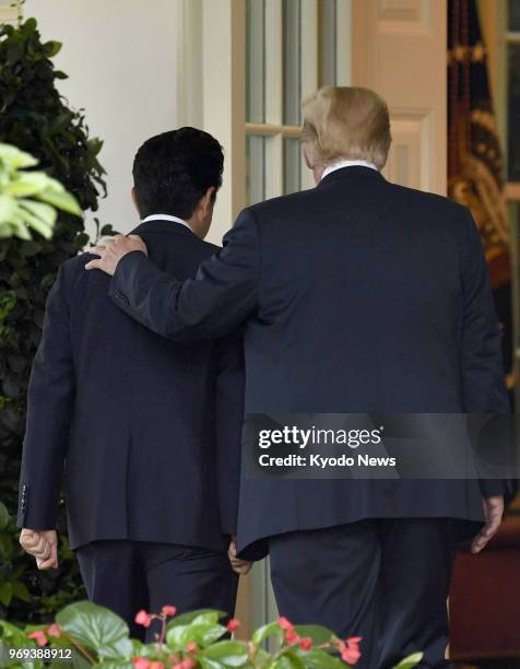 President Donald Trump and Japanese Prime Minister Shinzo Abe leave after holding a joint press conference following their talks at the White House...