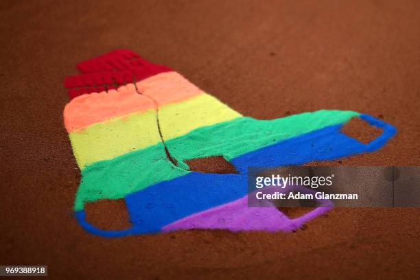 The Fenway Park mound displays the Red Sox logo as a Pride flag in honor of Pride night at Fenway Park before a game between the Detroit Tigers and...