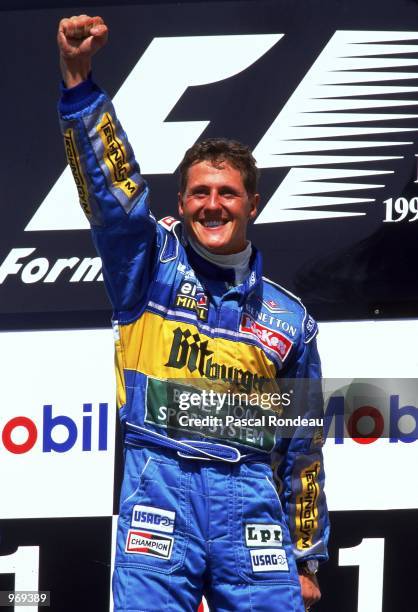 Benetton driver Michael Schumacher of Germany celebrates his win on the podium after the German Formula One Grand Prix held in Hockenheim, Germany. \...