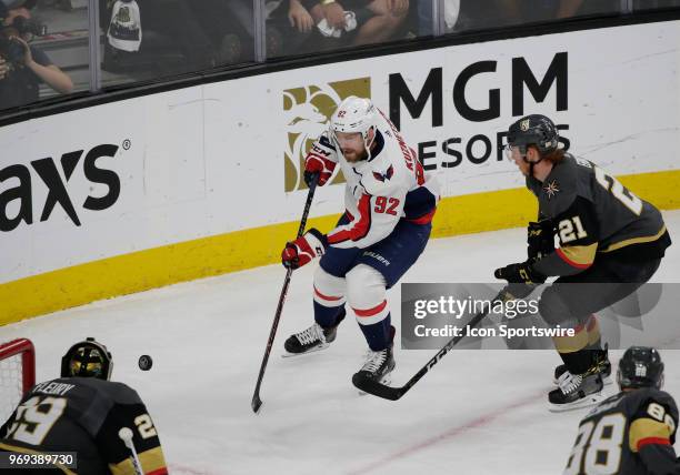 Washington Capitals center Evgeny Kuznetsov skates for control of the puck against Vegas Golden Knights center Cody Eakin during the first period of...