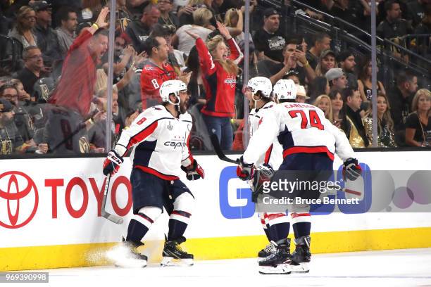 Alex Ovechkin of the Washington Capitals is congratulated by his teammates after scoring a second-period goal against the Vegas Golden Knights in...